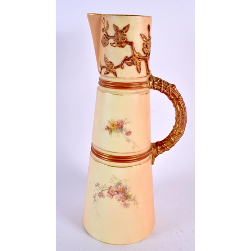 242 - Royal Worcester blush ivory claret jug painted and gilded with flowers. 25.5cm high.