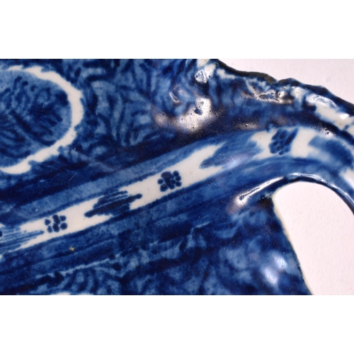 271 - 18th century Bow leaf shaped dish painted in blue with grape vine, with branch handle. 23cm wide.