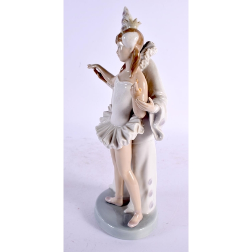 28 - A LLADRO FIGURE OF A BOY AND GIRL. 27 cm high.