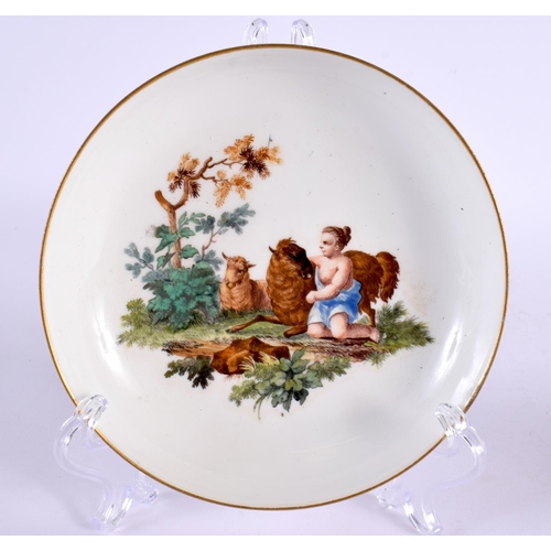 282 - 18th century Meissen teacup and saucer painted with children, crossed swords mark. Cup is 5cm high. ... 