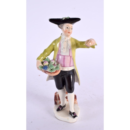 284 - Mid-18th century Vienna figure of a boy holding a basket of flowers and wearing a black tricorn hat ... 