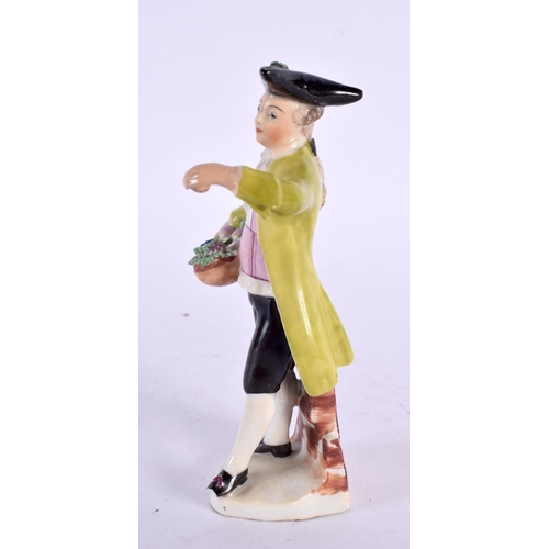 284 - Mid-18th century Vienna figure of a boy holding a basket of flowers and wearing a black tricorn hat ... 