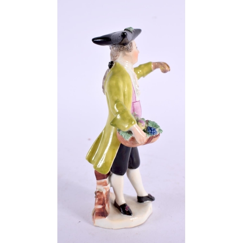 284 - Mid-18th century Vienna figure of a boy holding a basket of flowers and wearing a black tricorn hat ... 