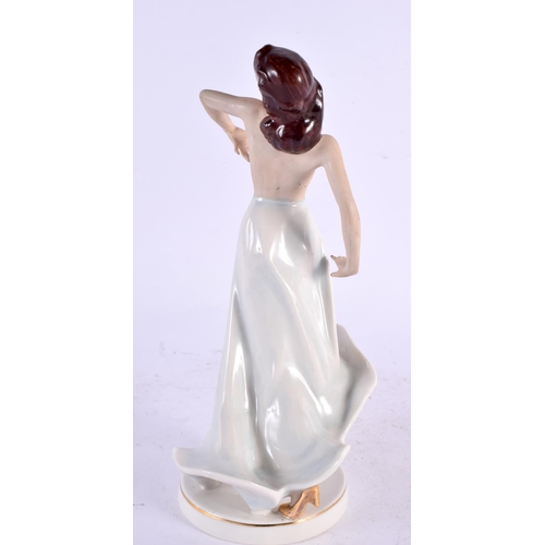 29 - AN ART DECO GERMAN PORCELAIN FIGURE OF A NUDE DANCER. 23 cm high.