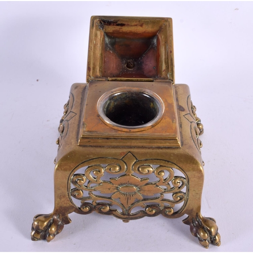 295 - A 19TH CENTURY EUROPEAN AESTHETIC MOVEMENT BRONZE INKWELL AND COVER formed with a seated Japanese fi... 