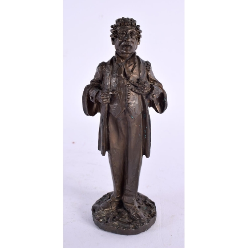 296 - A SMALL BRONZE FIGURE OF A STANDING CLASSICAL MALE possibly representing a dignitry. 13 cm high.