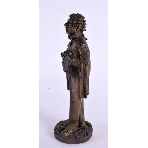 296 - A SMALL BRONZE FIGURE OF A STANDING CLASSICAL MALE possibly representing a dignitry. 13 cm high.