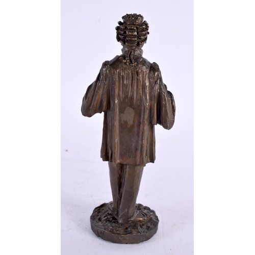 296 - A SMALL BRONZE FIGURE OF A STANDING CLASSICAL MALE possibly representing a dignitry. 13 cm high.