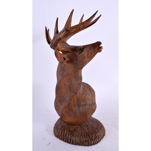 303 - AN EARLY 20TH CENTURY BAVARIAN BLACK FOREST BUST OF A STAG modelled upon a circular base. 26 cm x 9 ... 