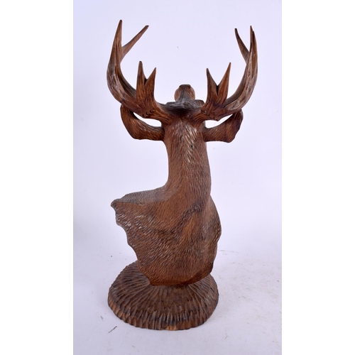 303 - AN EARLY 20TH CENTURY BAVARIAN BLACK FOREST BUST OF A STAG modelled upon a circular base. 26 cm x 9 ... 