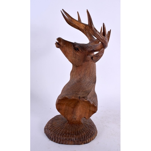 303 - AN EARLY 20TH CENTURY BAVARIAN BLACK FOREST BUST OF A STAG modelled upon a circular base. 26 cm x 9 ... 