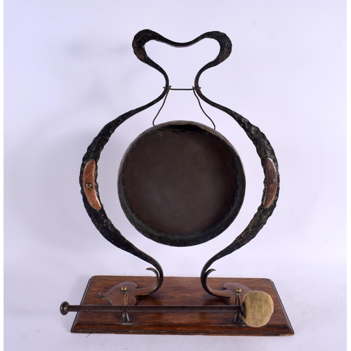 305 - A STYLISH ART NOUVEAU WROUGHT IRON AND COPPER DINNER GONG of organic scrolling form. 40 cm x 28 cm.