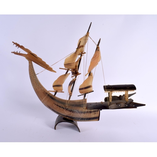 322 - A LARGE PAIR OF EARLY 20TH CENTURY MIDDLE EASTERN CARVED HORN BOATS formed with dragon and bird head... 