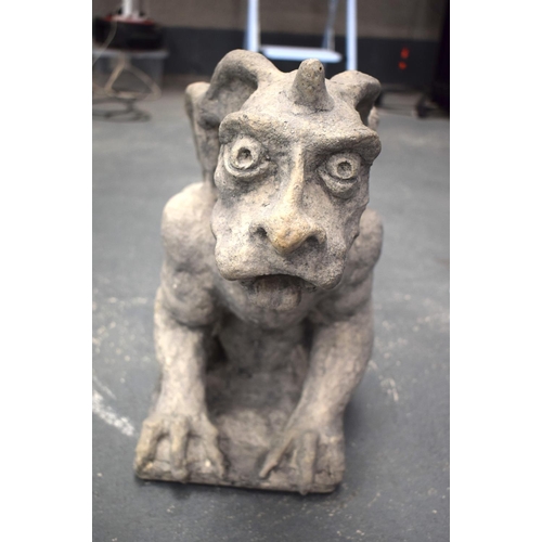 323 - A LOVELY LARGE 19TH/20TH CENTURY CARVED DERBSHIRE STONE GARGOYLE modelled scowling. 48 cm x 58 cm.