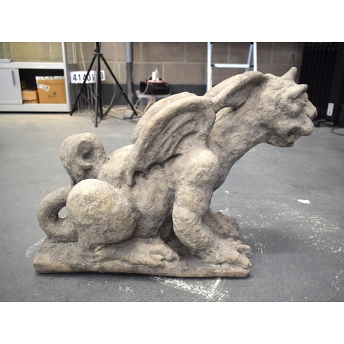 323 - A LOVELY LARGE 19TH/20TH CENTURY CARVED DERBSHIRE STONE GARGOYLE modelled scowling. 48 cm x 58 cm.