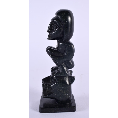 324 - A NORTH AMERICAN CARVED HAIDA ARGALLITE TOTEM POLE SCULPTURE. 13 cm high.