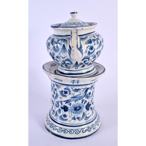 327 - A DELFT BLUE AND WHITE TEAPOT ON STAND painted with birds and foliage. 21 cm x 15 cm.