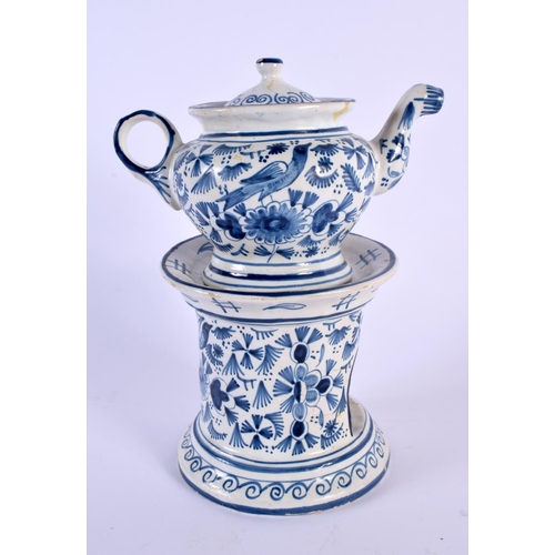 327 - A DELFT BLUE AND WHITE TEAPOT ON STAND painted with birds and foliage. 21 cm x 15 cm.