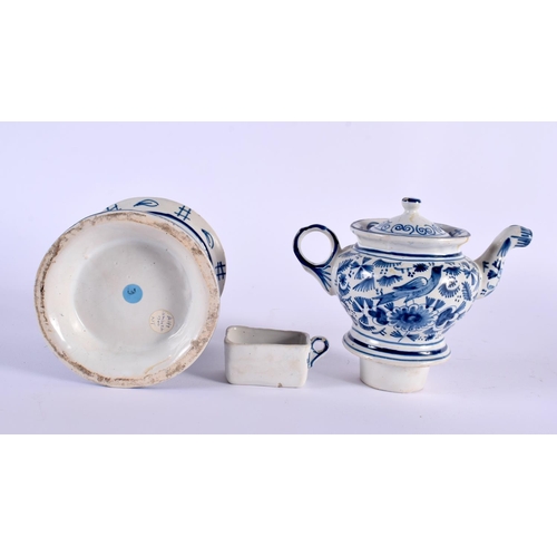 327 - A DELFT BLUE AND WHITE TEAPOT ON STAND painted with birds and foliage. 21 cm x 15 cm.