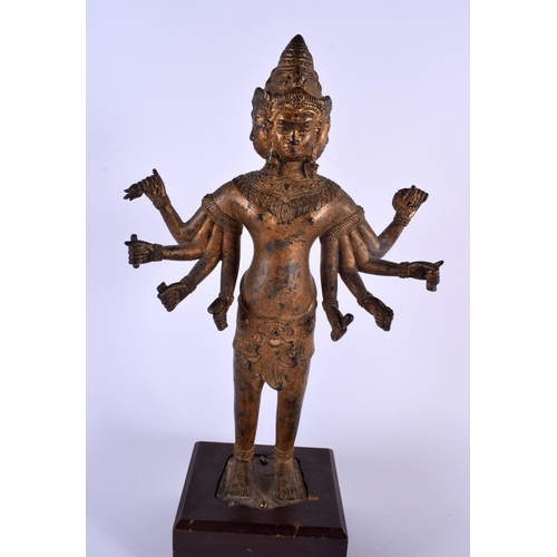 329 - A LARGE 19T CENTURY SOUTH EAST ASIAN BRONZE FIGURE OF A DEITY together with a gilded head of a buddh... 