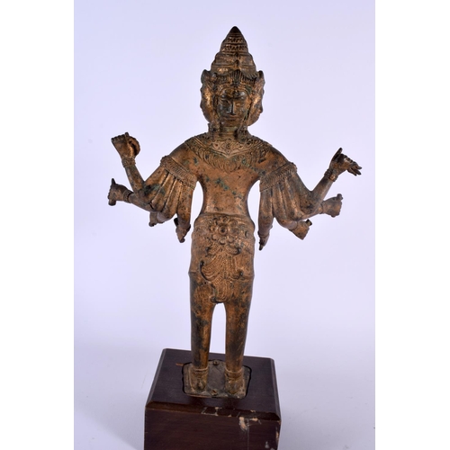 329 - A LARGE 19T CENTURY SOUTH EAST ASIAN BRONZE FIGURE OF A DEITY together with a gilded head of a buddh... 