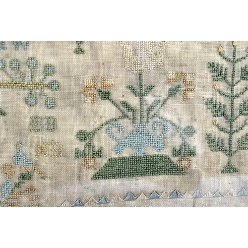 341 - AN EARLY 19TH CENTURY FRAMED AND EMBROIDERED ENGLISH SAMPLER depicting houses and landscapes. 54 cm ... 