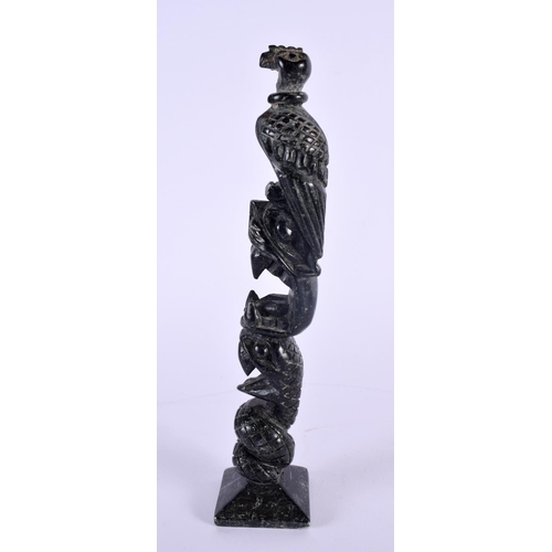 354 - AN UNUSUAL EARLY 20TH CENTURY TRIBAL CARVED STONE TOTEM POLE possibly Argallite. 23 cm high.