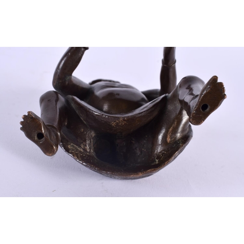 356 - A 19TH CENTURY JAPANESE MEIJI PERIOD BRONZE OKIMONO OF ONI modelled upon an iron seat. 16 cm x 8 cm.