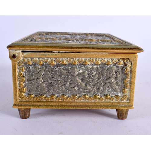 380 - A VINTAGE MIXED METAL REPOUSSE MUSICAL BOX. 12.5 cm x 10 cm.