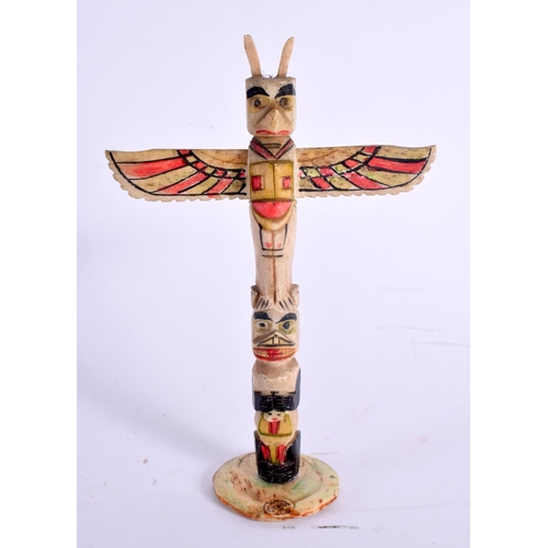 388 - A VINTAGE NORTH AMERICAN CARVED BONE TOTEM POLE together with a South American funeral figure. Large... 