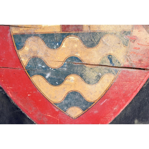 389 - AN EARLY 20TH CENTURY PAINTED WOOD COUNTRY HOUSE ARMORIAL SHIELD depicting a coat of arms. 40 cm x 3... 