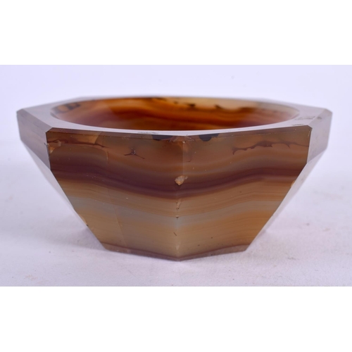 396 - AN ANTIQUE CARVED AGATE SALT of octagonal form. 8.5 cm wide.