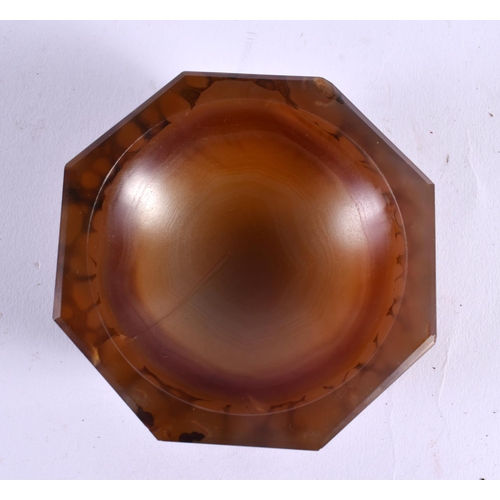 396 - AN ANTIQUE CARVED AGATE SALT of octagonal form. 8.5 cm wide.