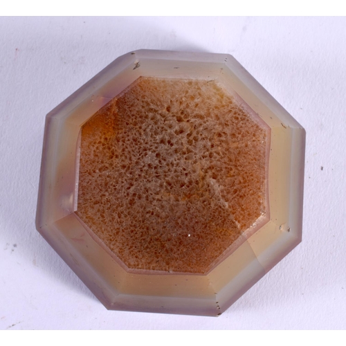 396 - AN ANTIQUE CARVED AGATE SALT of octagonal form. 8.5 cm wide.