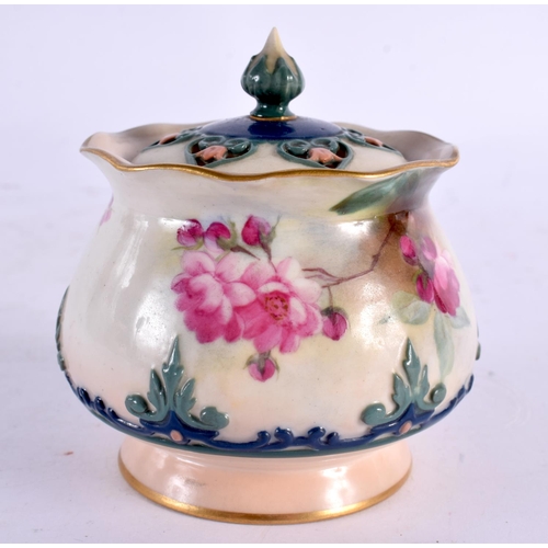 40 - A ROYAL WORCESTER PORCELAIN POT POURRI AND COVER painted with flowers. 7 cm wide.