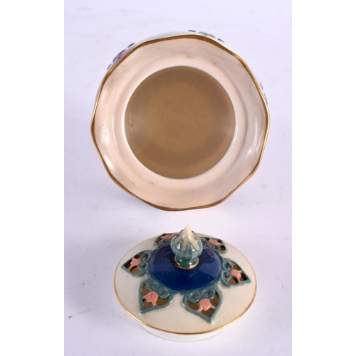 40 - A ROYAL WORCESTER PORCELAIN POT POURRI AND COVER painted with flowers. 7 cm wide.