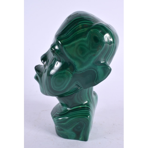 407 - AN EARLY 20TH CENTURY AFRICAN CARVED MALACHITE BUST. 16 cm x 7 cm.