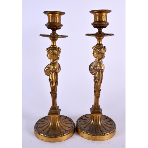 411 - A FINE PAIR OF MID 19TH CENTURY FRENCH BRONZE CANDLESTICKS formed with semi clad females. 27 cm high... 