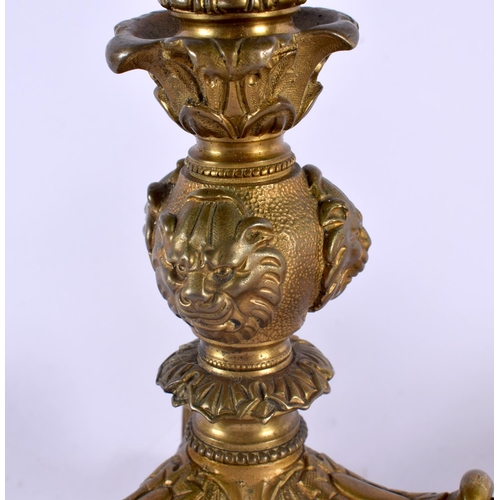 412 - A PAIR OF MID 19TH CENTURY FRENCH BRONZE CANDLESTICKS formed with lion and elephant mask heads. 35 c... 