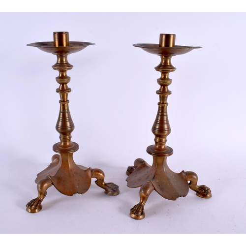 414 - A PAIR OF 19TH CENTURY FRENCH BRONZE CANDLESTICKS of scrolling organic form with paw feet. 30 cm hig... 