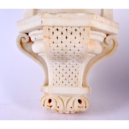 418 - AN EARLY 20TH CENTURY EUROPEAN CARVED WHITE MARBLE FONT formed with scrolling arches and baskets of ... 