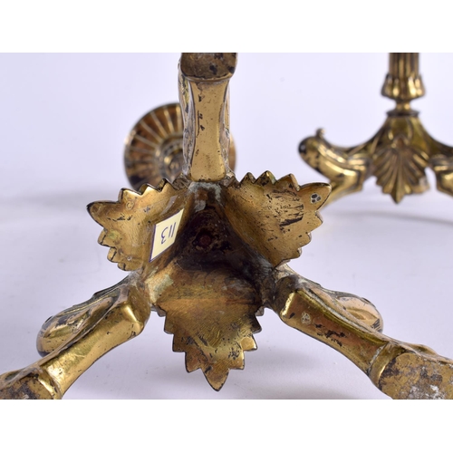 420 - A PAIR OF 19TH CENTURY FRENCH BRONZE CANDLESTICKS formed with feet beside shells. 30 cm high.