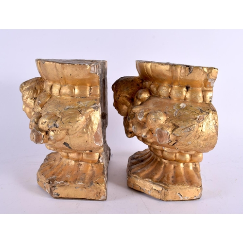 421 - A PAIR OF 18TH/19TH CENTURY CONTINENTAL COUNTRY HOUSE PUTTI STANDS formed with shell capped bases. 2... 