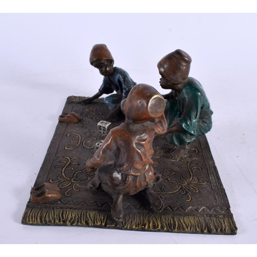 423 - A CONTEMPORARY COLD PAINTED BRONZE FIGURAL GROUP depicting children playing dice. 20 cm x 14 cm.