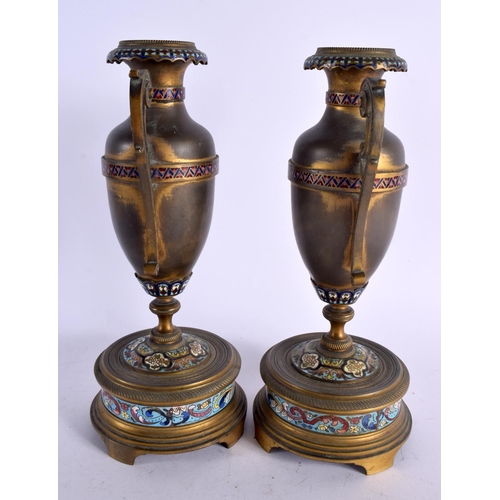 434 - A LARGE 19TH CENTURY FRENCH CHAMPLEVE ENAMEL AND BRONZE CLOCK GARNITURE decorated all over with foli... 