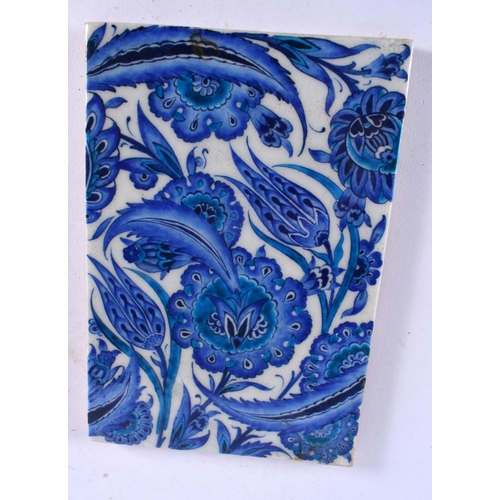 436 - TWO MIDDLE EASTERN IZNIK TILES painted with foliage. 24 cm x 17 cm. (2)