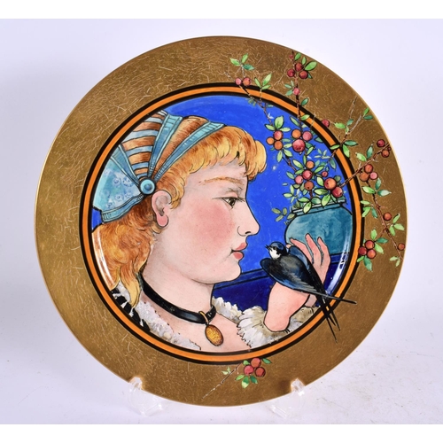 44 - A LOVELY AESTHETIC MOVEMENT BROWN WESTHEAD MOORE & CO PLATE painted with a female with bird. 25 cm d... 