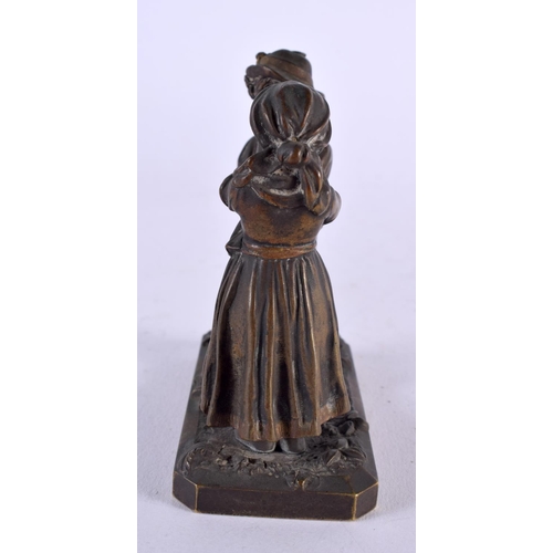 447 - AN ANTIQUE BRONZE FIGURAL GROUP modelled as a boy and girl. 9.5 cm x 8.5 cm.