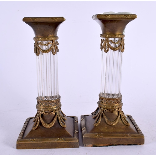 450 - A PAIR OF LATE 19TH CENTURY FRENCH GILT METAL CRYSTAL GLASS CANDLESTICKS formed as corinthian column... 