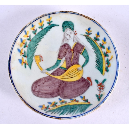 451 - A PAIR OF TURKISH KUTAHYA MIDDLE EASTERN PLATES painted with figures. 13 cm diameter.